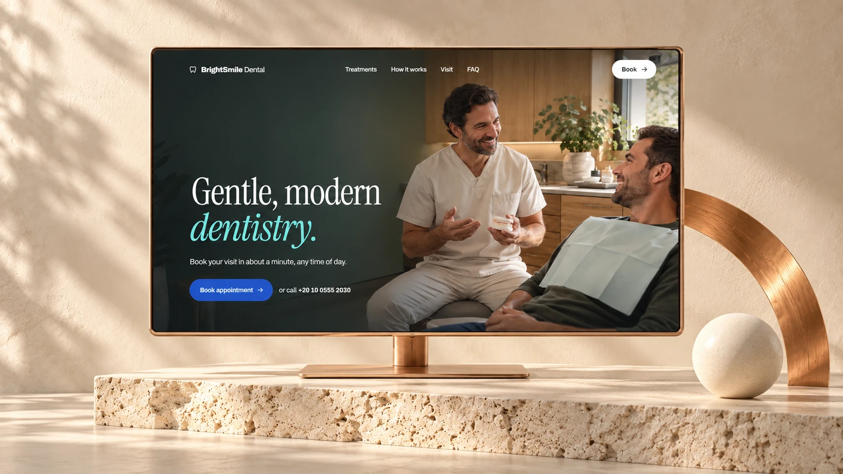BrightSmile Dental website displayed on a copper monitor in a warm ivory studio